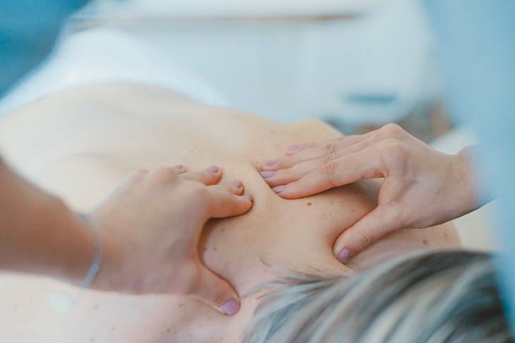 person receiving remedial back massage